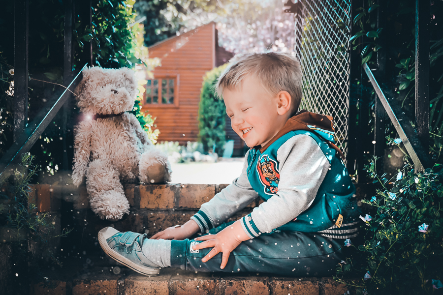 boy laughing on steps